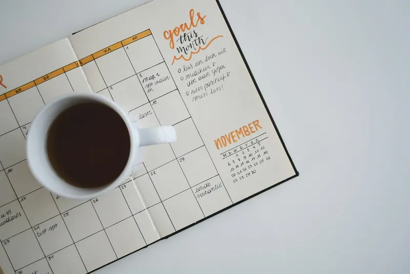 Month end close calendar marked up with reconciliation and reporting deadlines